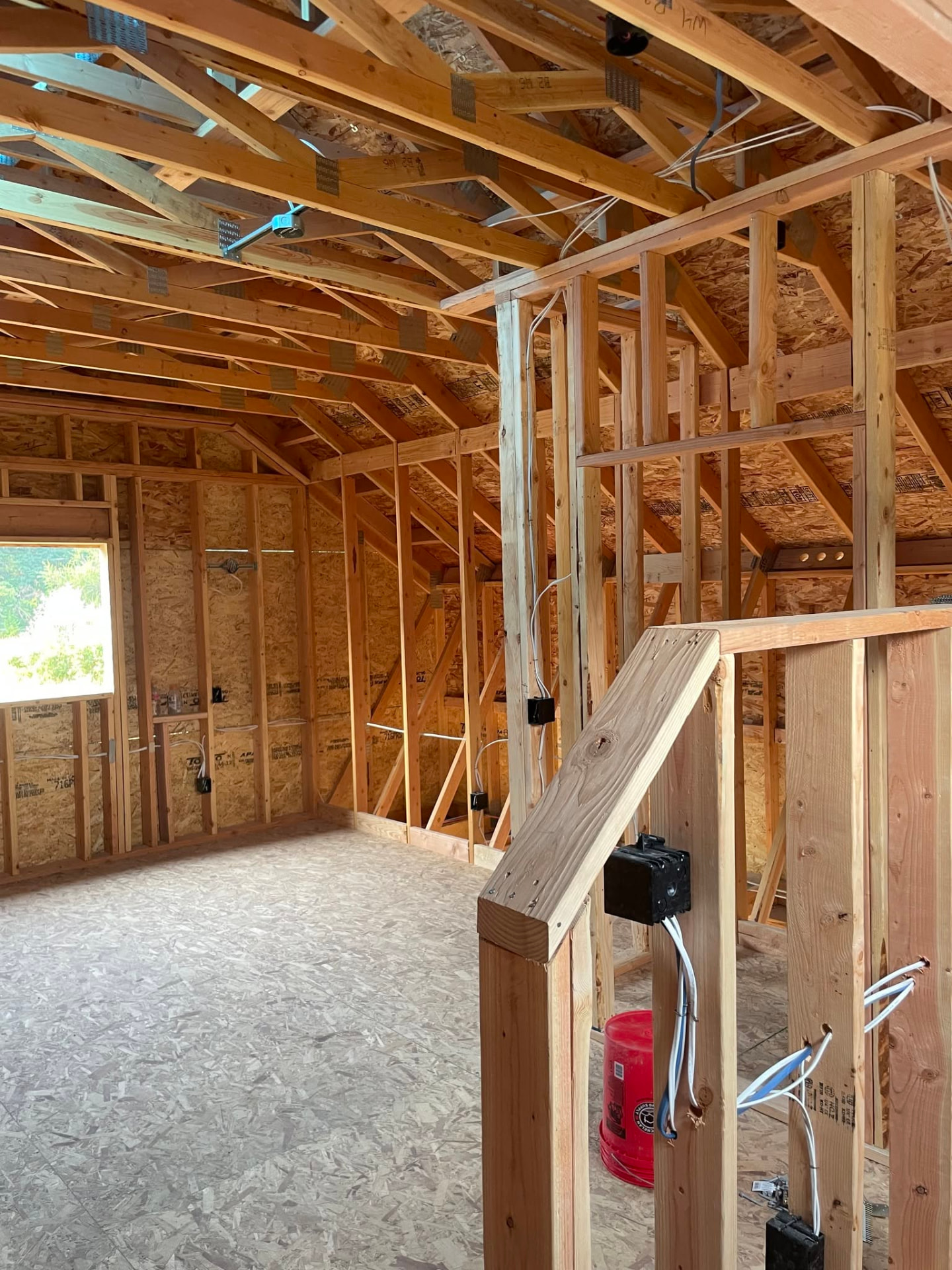 Garage interior framing with studs and roof members in place