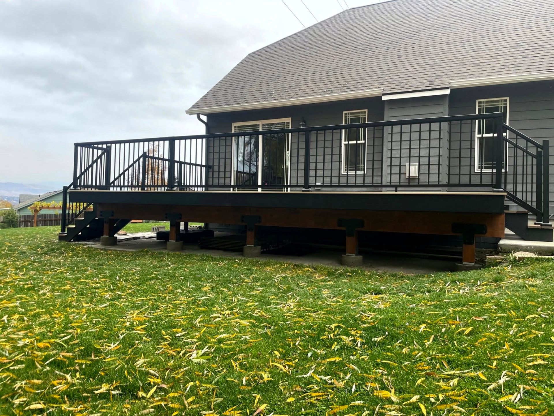 Elevated deck with black metal railing